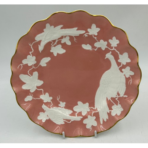 412 - Two royal Crown Derby plates, a Pink Chinese Birds in white relief and a red/gilt bird plate 21.5cm ... 