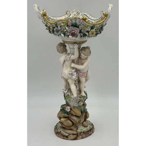 413 - A late 19thC Dresden Cherub figurine in the Meissen style, blue marked crossed swords, with twin han... 