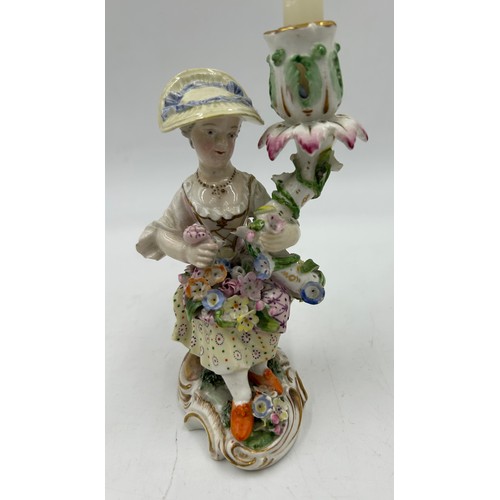 414 - A pair of late 19thC Meissen style Figural Candle Holders with decorative flowers 15cm h. Blue cross... 