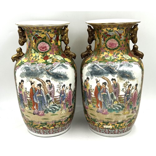 1007 - A pair of 20thC Chinese famille rose vases. 36cm h.