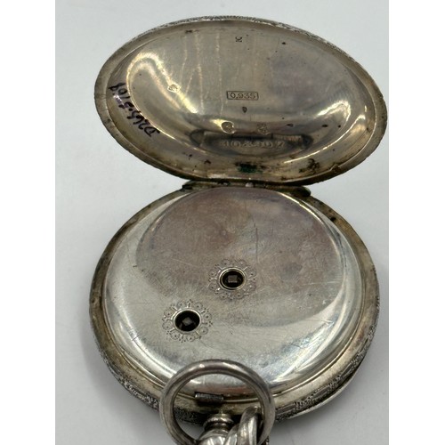 877 - A Continental silver pocket watch 4cm diameter, together with a hallmarked silver fob chain, marks i... 