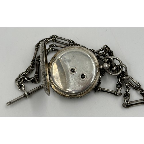 877 - A Continental silver pocket watch 4cm diameter, together with a hallmarked silver fob chain, marks i... 