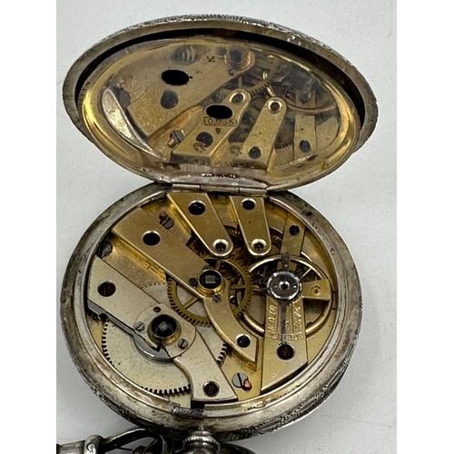 877 - A Continental silver pocket watch 4cm diameter, together with a hallmarked silver fob chain, marks i... 