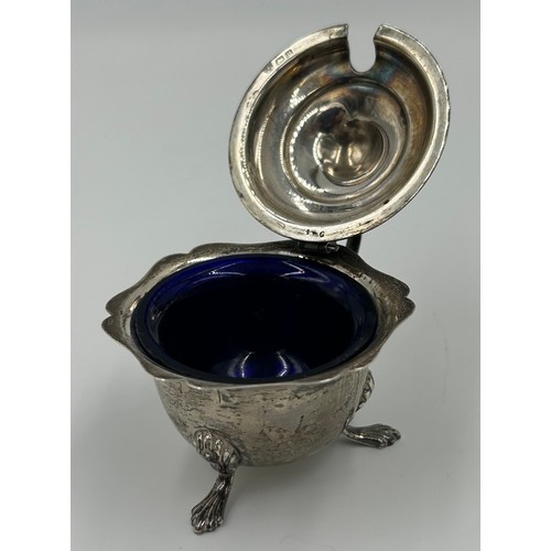 875 - Three Silver Salt Cellars engraved with J and a spoon by Charles Edwards London 1907, a Mustard Pot ... 