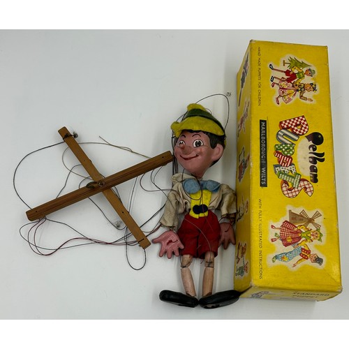 1305 - Five vintage Pelham Puppets to include Pinocchio, Mickey Mouse, Minnie Mouse, Goofy and Rupert The B... 