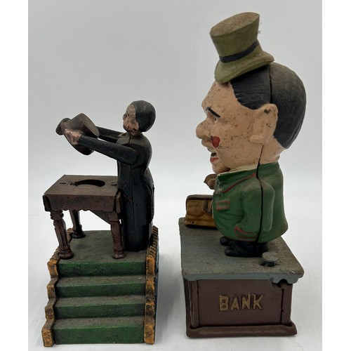 1431 - Two late 19thC Cast Iron Money Boxes 'Magicians Bank' mechanically working with stopper to base 19cm... 