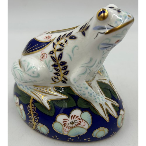 434 - Two Royal Crown Derby Money Boxes with gold stoppers to include Frog on Lily Pad 12cm & Seated Pig 1... 