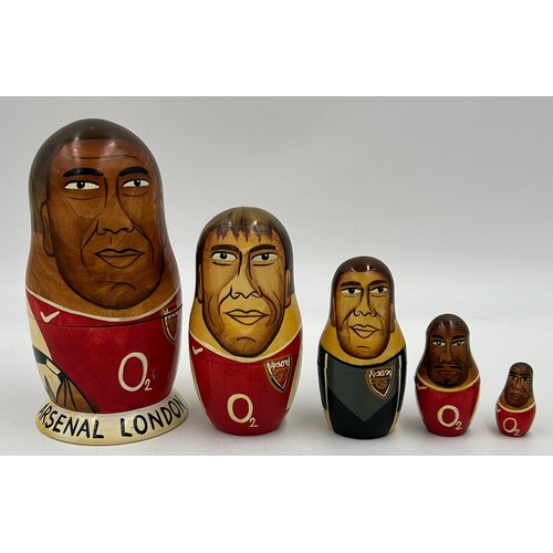 463 - A collection of Russian Matryoshka wooden dolls to include Humpty Dumpty, Arsenal Football team, Rus... 