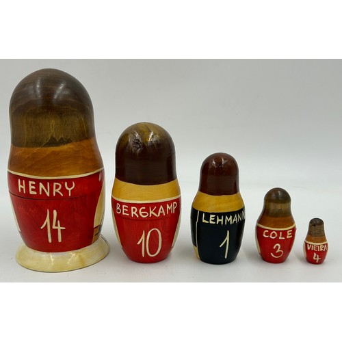 463 - A collection of Russian Matryoshka wooden dolls to include Humpty Dumpty, Arsenal Football team, Rus... 