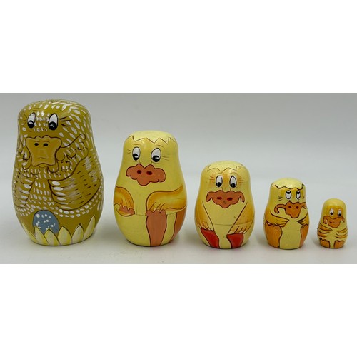 463 - A collection of Russian Matryoshka wooden dolls to include Humpty Dumpty, Arsenal Football team, Rus... 