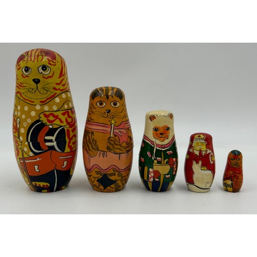 463 - A collection of Russian Matryoshka wooden dolls to include Humpty Dumpty, Arsenal Football team, Rus... 