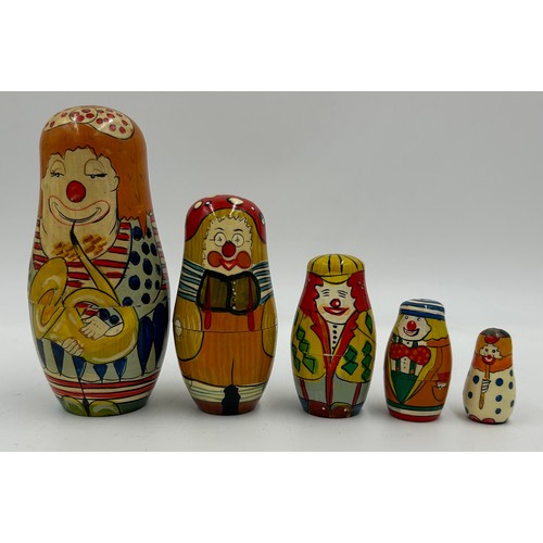 463 - A collection of Russian Matryoshka wooden dolls to include Humpty Dumpty, Arsenal Football team, Rus... 