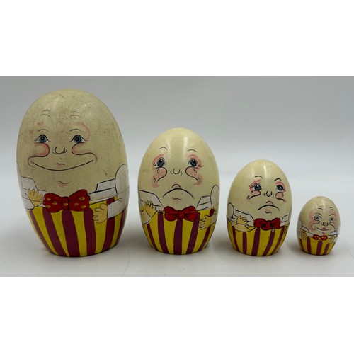 463 - A collection of Russian Matryoshka wooden dolls to include Humpty Dumpty, Arsenal Football team, Rus... 