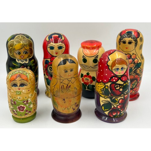 463 - A collection of Russian Matryoshka wooden dolls to include Humpty Dumpty, Arsenal Football team, Rus... 