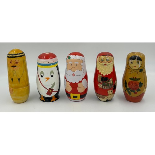 463 - A collection of Russian Matryoshka wooden dolls to include Humpty Dumpty, Arsenal Football team, Rus... 