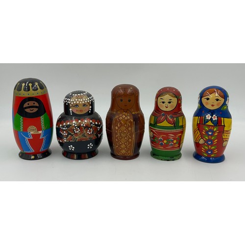 463 - A collection of Russian Matryoshka wooden dolls to include Humpty Dumpty, Arsenal Football team, Rus... 