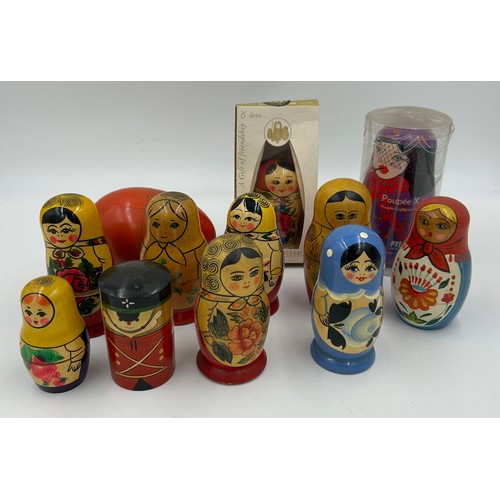 463 - A collection of Russian Matryoshka wooden dolls to include Humpty Dumpty, Arsenal Football team, Rus... 