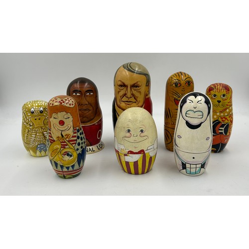 463 - A collection of Russian Matryoshka wooden dolls to include Humpty Dumpty, Arsenal Football team, Rus... 