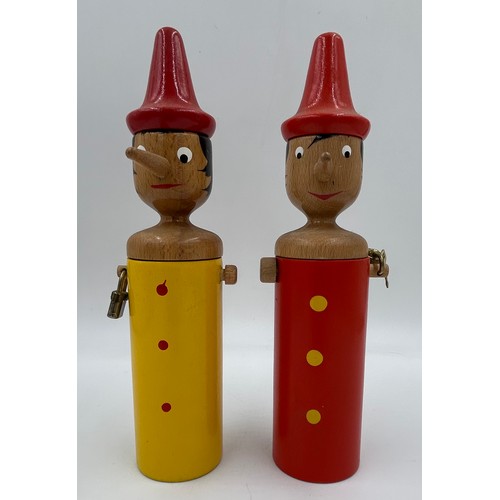 464 - Four Italian wooden Pinocchio figures 2 of which are money boxes with keys. Tallest 51cm.