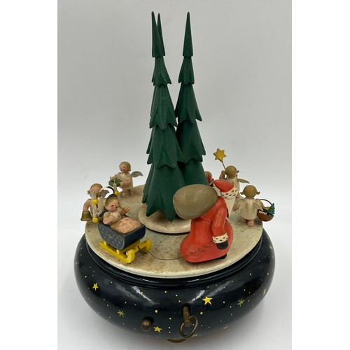 466 - A collection of Erzgebirge hand painted German wooden Christmas themed music boxes to include Christ... 