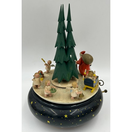 466 - A collection of Erzgebirge hand painted German wooden Christmas themed music boxes to include Christ... 