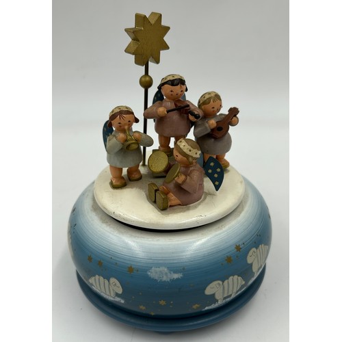 466 - A collection of Erzgebirge hand painted German wooden Christmas themed music boxes to include Christ... 