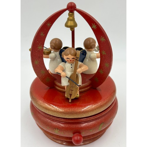 466 - A collection of Erzgebirge hand painted German wooden Christmas themed music boxes to include Christ... 