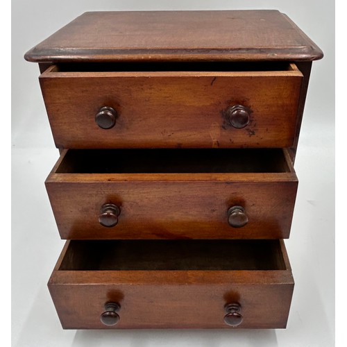 1064 - A mahogany apprentice 3 drawer chest measuring 24cm h along with a oak box with dome tambour with en... 