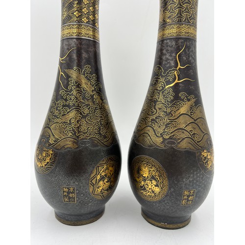 1019 - Pair of Japanese Damascened iron vases from Komai of Kyoto, both signed in gold to base areas. 31cm ... 