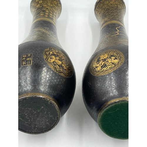 1019 - Pair of Japanese Damascened iron vases from Komai of Kyoto, both signed in gold to base areas. 31cm ... 