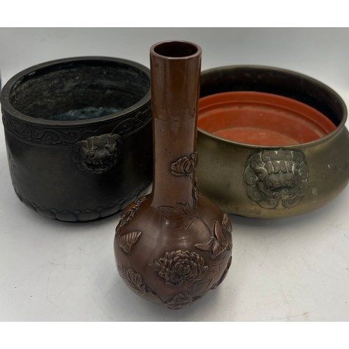 1037 - Two oriental bronze bowls with marks to base and a vase decorated with chrysanthemums 15cm h.