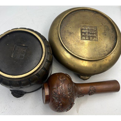 1037 - Two oriental bronze bowls with marks to base and a vase decorated with chrysanthemums 15cm h.