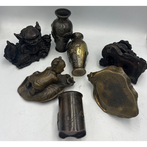 1038 - Japanese bronze figures to include a pair of Foo dogs, vases 9cm h, children on lily pads etc.