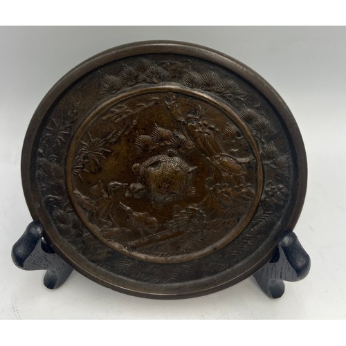 1042 - Japanese bronze plate 10.5cm d together with figure of rat on fruit and two dragon figures.