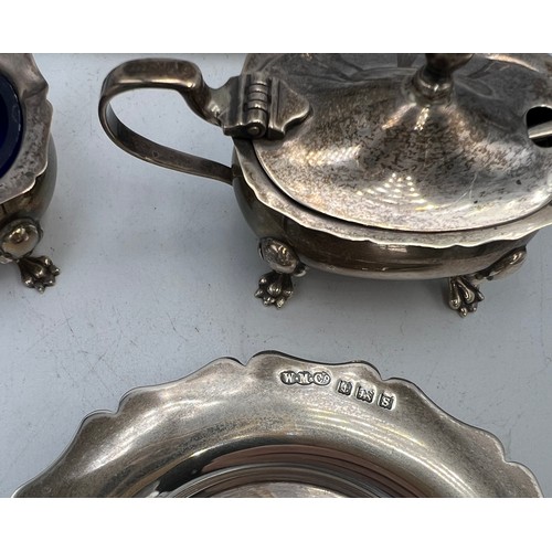 855 - Hallmarked silver to include Victorian toast rack, Birmingham 1886, three piece cruet set with two s... 