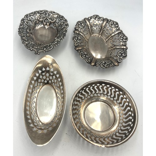 863 - Four hallmarked silver dishes, various dates and makers. Total weight 113gm. Largest 11cm x 9cm.