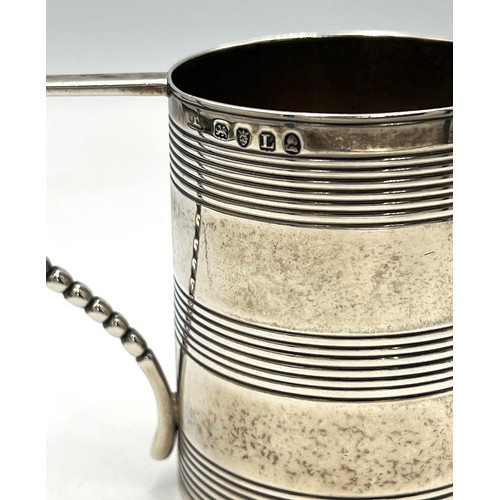 864 - A Georgian silver tankard. London 1806, maker’s marks rubbed. Height 7cm. Weight 143gm.