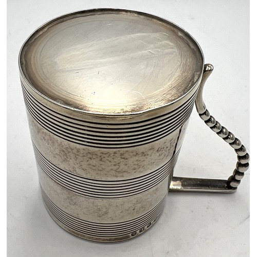 864 - A Georgian silver tankard. London 1806, maker’s marks rubbed. Height 7cm. Weight 143gm.