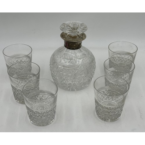 503 - A crystal decanter and stopper with silver collar together with 6 x Tudor crystal tumblers.