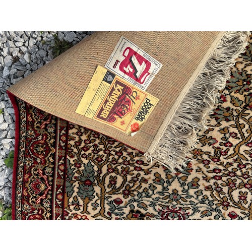 1288 - A Kandahar pure virgin wool pile rug made in Belgium with red, cream and sage green design, 161 x 89... 