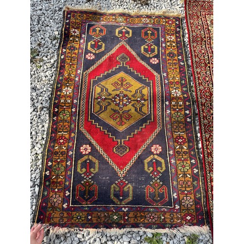 1288 - A Kandahar pure virgin wool pile rug made in Belgium with red, cream and sage green design, 161 x 89... 