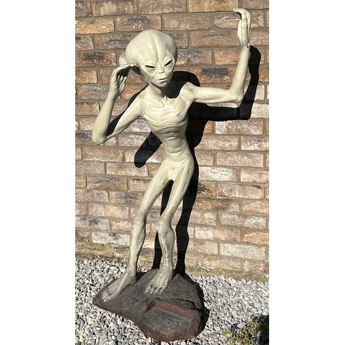 1414 - A life size model of an Alien made from resin with a CD holder standing on a heavy base with makers ... 