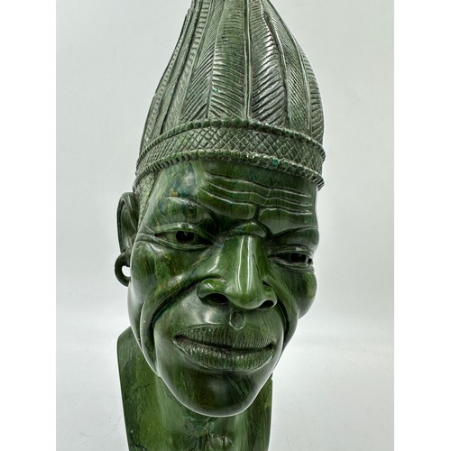 1004 - A 'Masai Man' carved in South African Verdite by Naboth Kudzunga 43cm h. With a certificate of authe... 