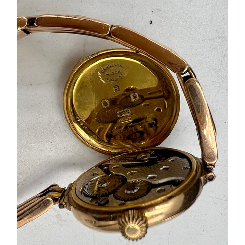 763 - A 9 carat gold ladies wristwatch on expanding 9 carat chain bracelet. Total weight 26.7gm.