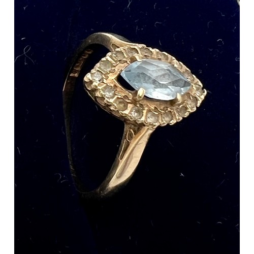 712 - A nine carat gold ring set with blue and clear stones. Size M. Weight 2.5gm.