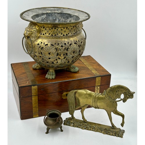 1376 - A miscellany to include a wooden writing box, a brass pierced jardinière with lion head handles and ... 