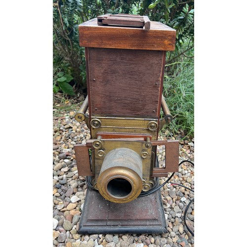 1378 - A 19thC mahogany and brass magic lantern. 52 h x 24 w x 43cm d.