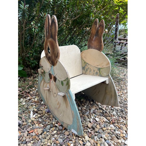 49 - A Beatrix Potter child's rocking chair. 65 h x 36 w x 28cm ht to seat.