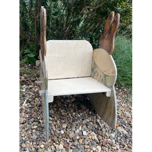 49 - A Beatrix Potter child's rocking chair. 65 h x 36 w x 28cm ht to seat.