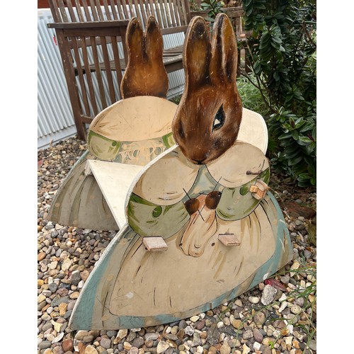 49 - A Beatrix Potter child's rocking chair. 65 h x 36 w x 28cm ht to seat.